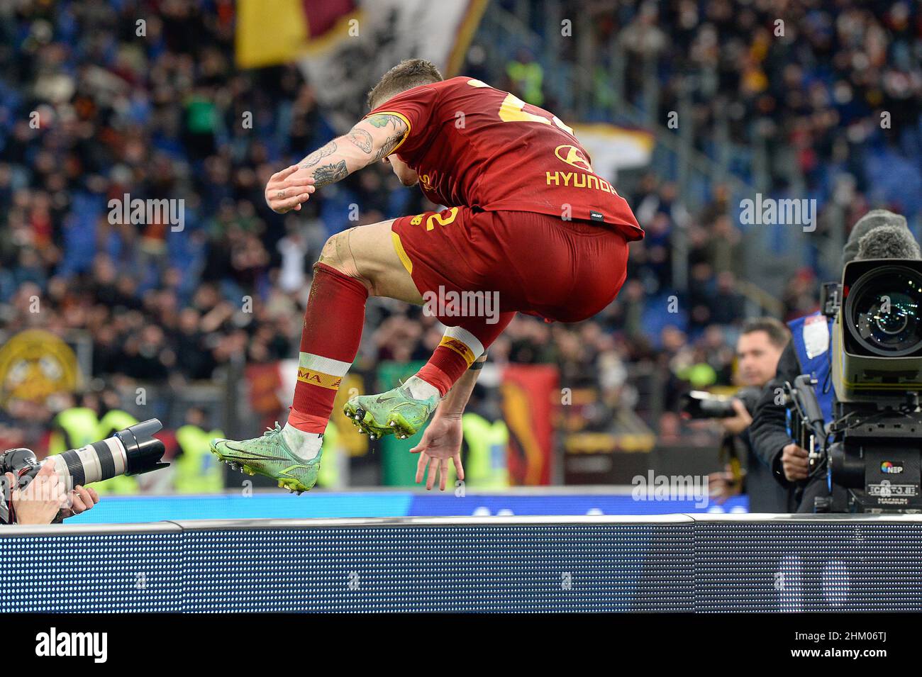 Johan Vasquez of Genoa CFC and Nicolò Zaniolo of AS Roma during football  Serie A Match at Stadio Olimpico, As Roma v Genoa on February 5, 2022 in  Rome, Italy. (Photo by