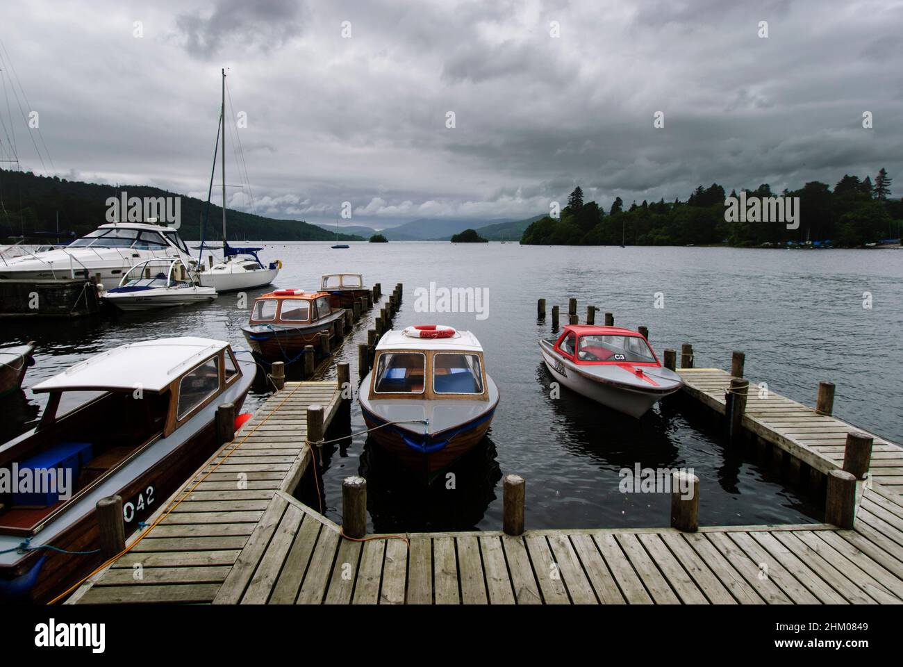 Windermere is a large lake in Cumbria’s Lake District National Park, northwest England. It’s surrounded by mountain peaks and villages, including Bown Stock Photo