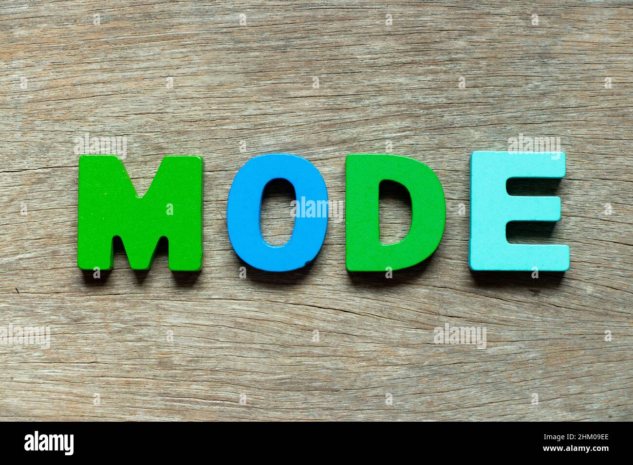 Color alphabet letter in word mode on wood background Stock Photo - Alamy