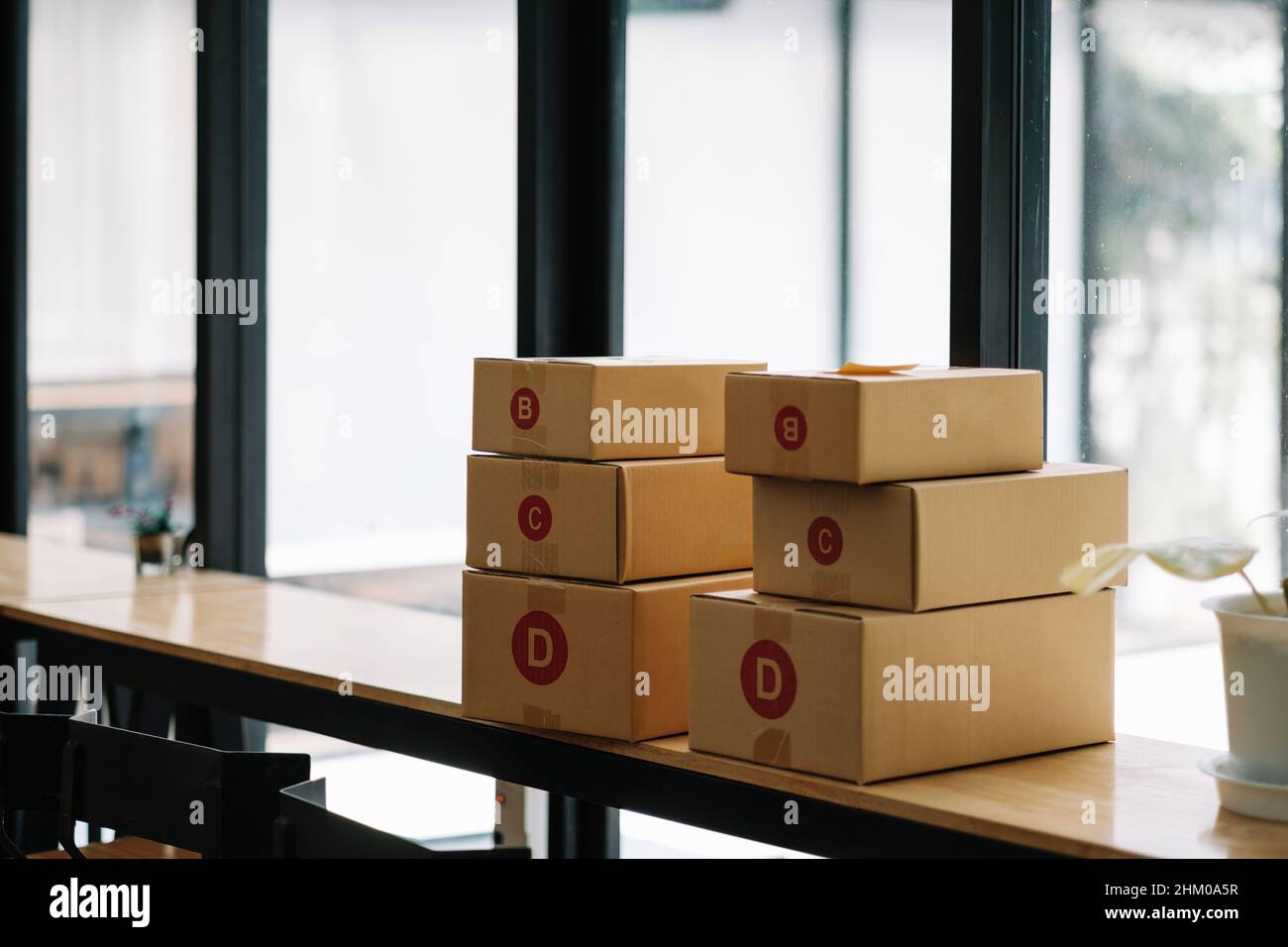 Ready to shipping, group of cardboard box delivery on wooden desk Stock