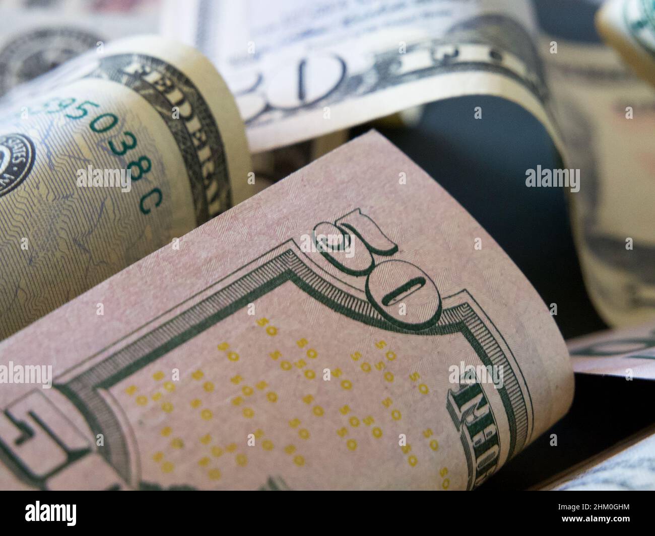 Banknotes with a face value of 50 dollars closeup. American paper