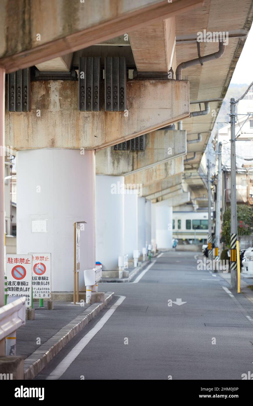 Right side street under a railway during daytime in Japan Stock Photo
