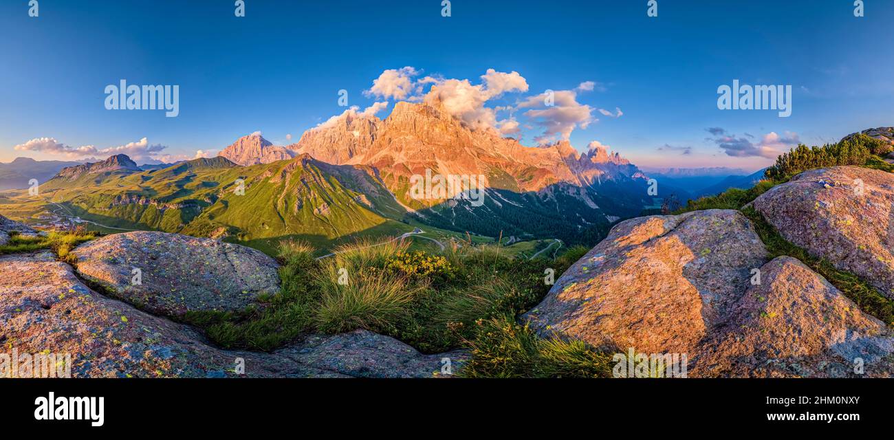 Panoramic view of the summits and rock faces of the Pala group, Cimon della Pala, one of the main summits, standing out, at sunset. Stock Photo