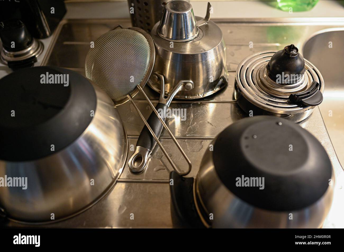 kitchen ware standing on sink drying afterwashing Stock Photo