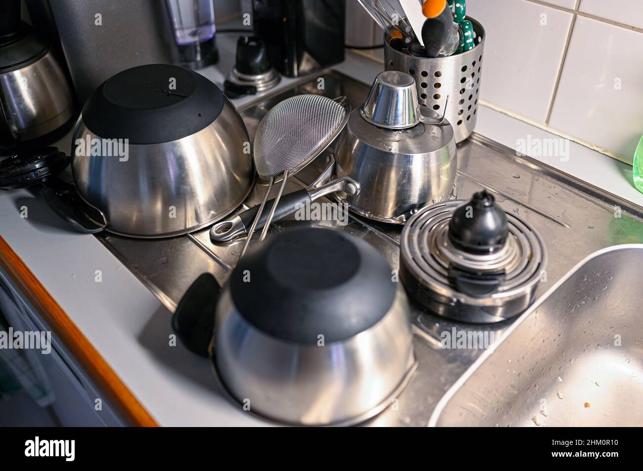 kitchen ware standing on sink drying afterwashing Stock Photo
