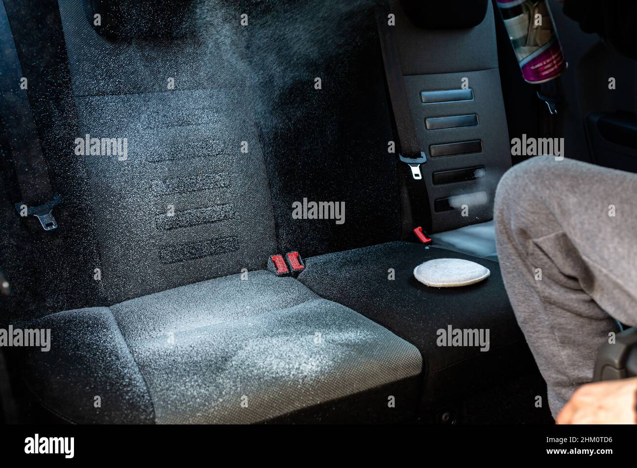 Close up of dry cleaning the car interior with special foam. Car care