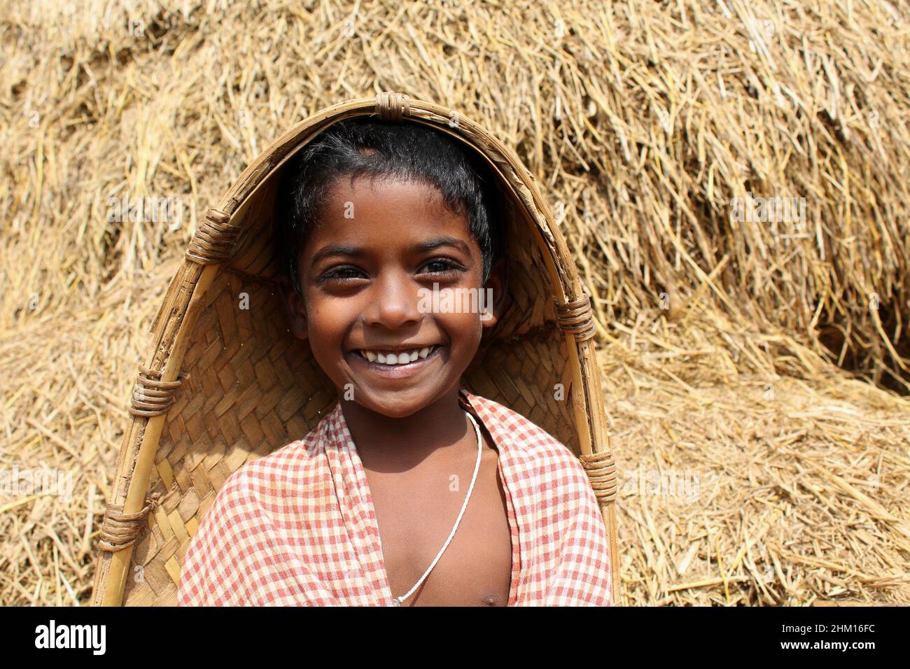 Smiling Rural Kid A portrait of a young smiling kid at his home in a rural village ...