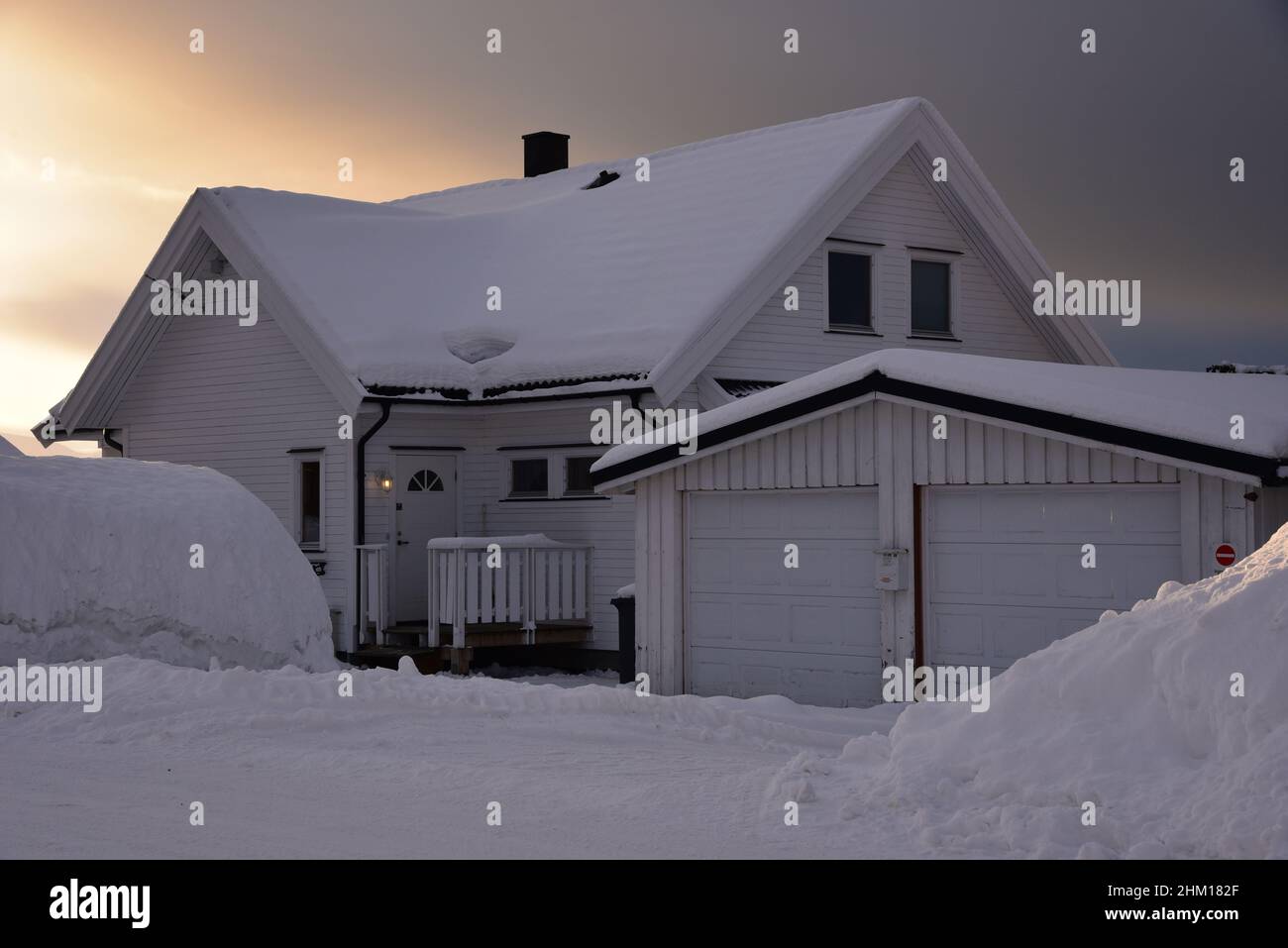 Typical Norwegian house covered by snow in Tromsø, a city in northern