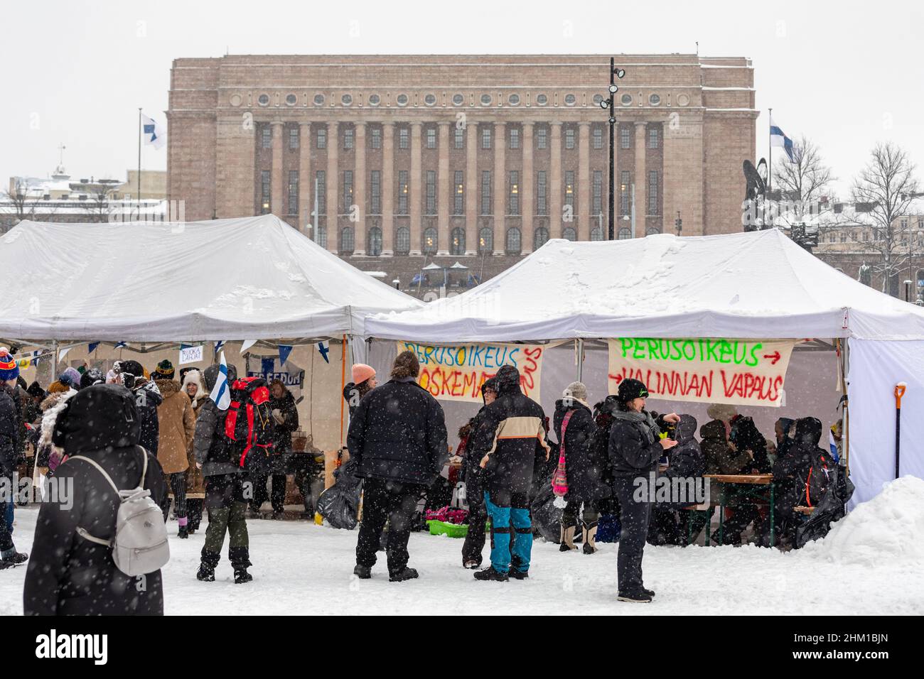 Freedom Convoy Finland camp on Kansalaistori Square with Parliament House in the background in Helsinki, Finland Stock Photo