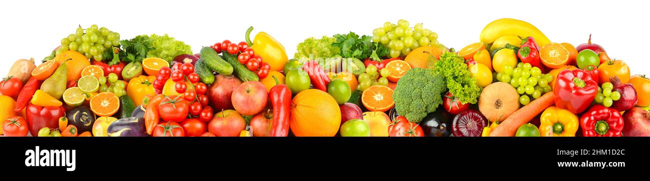 Wide panoramic composition of ripe, juicy fruits and vegetables isolated on white background. Stock Photo
