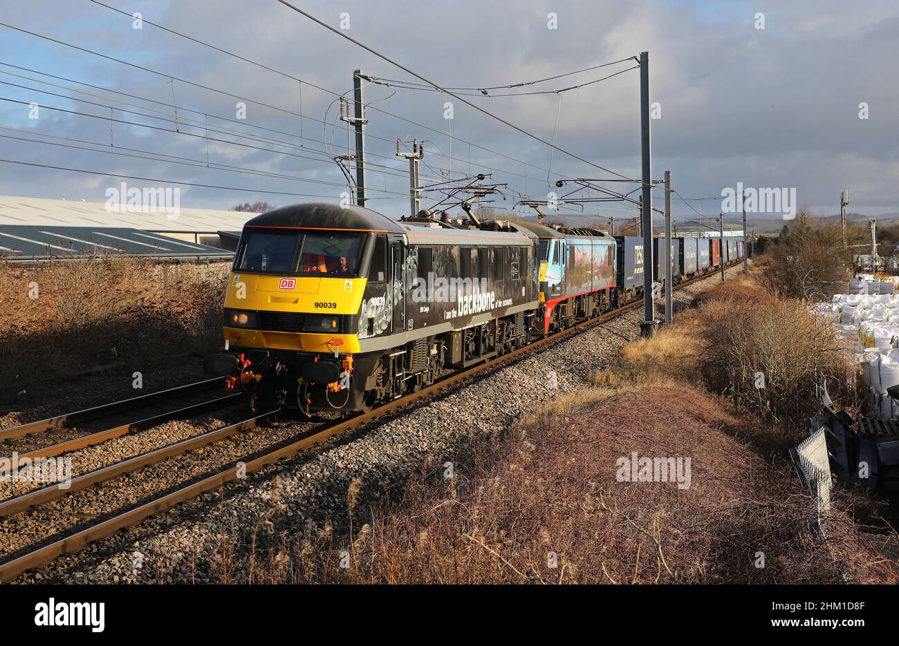 DB 90039 & 90024 pass Carnforth on 4.2.22 with 4M25 Mossend to Daventry. Stock Photo