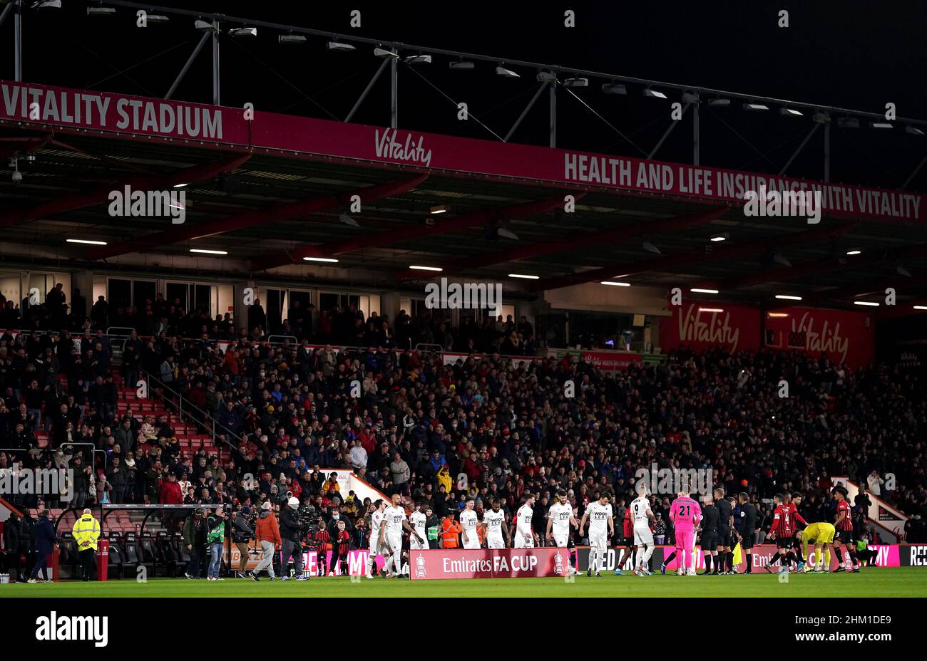 Boreham Wood and AFC Bournemouth players walk onto the pitch prior to kick-off in the Emirates FA Cup fourth round match at the Vitality Stadium, Bournemouth. Picture date: Sunday February 6, 2022. Stock Photo