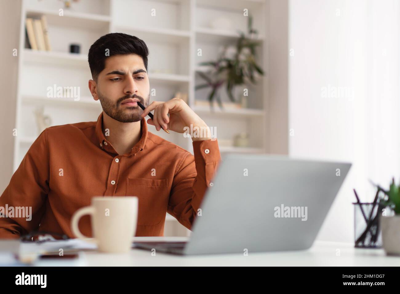 Pensive arab man sitting hi-res stock photography and images - Alamy