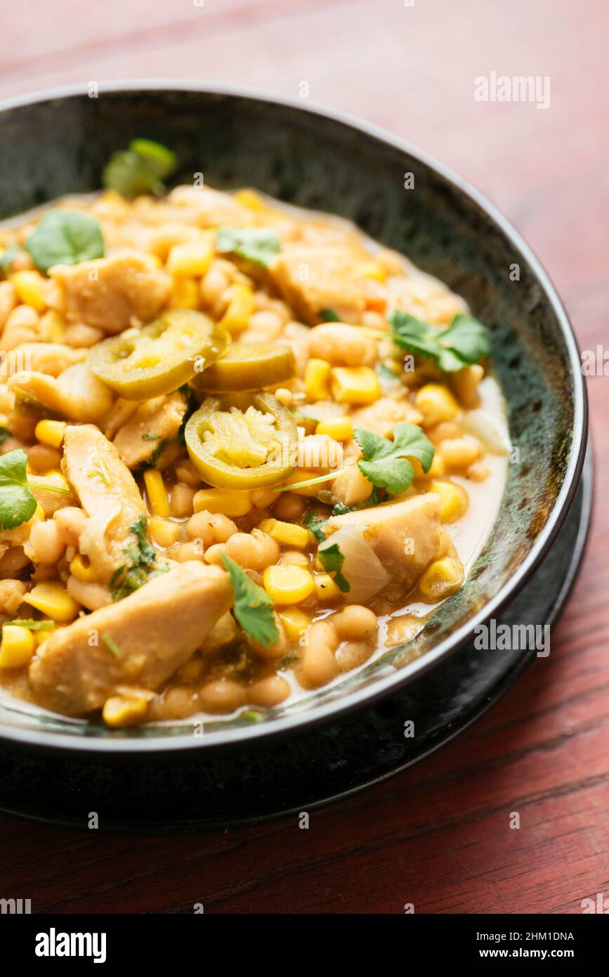 Bowl with a vegan home made white bean and chickun chili. Stock Photo