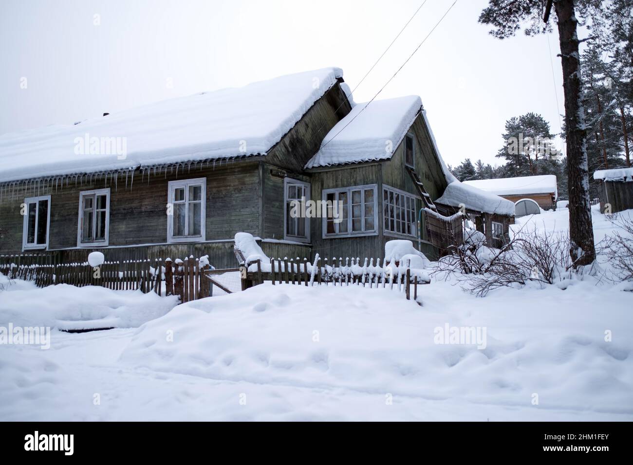View of house in a Russian village in snowy winter Stock Photo - Alamy