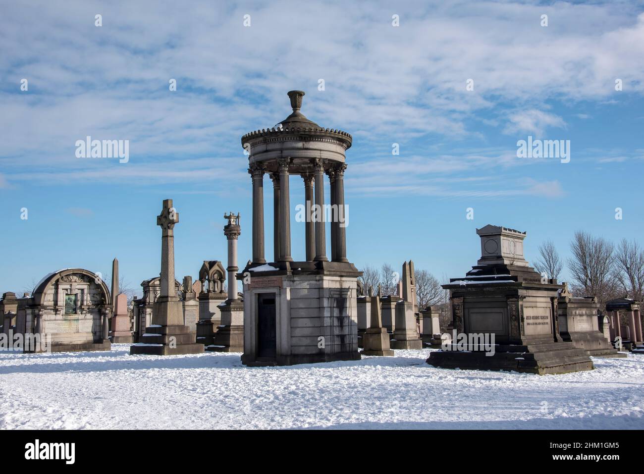 Gravestones in the snow at Necropolis Cemetry, Glasgow, Scotland. Stock Photo