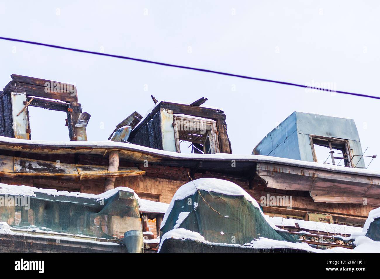 dilapidated housing emergency demolition after fire old city Stock