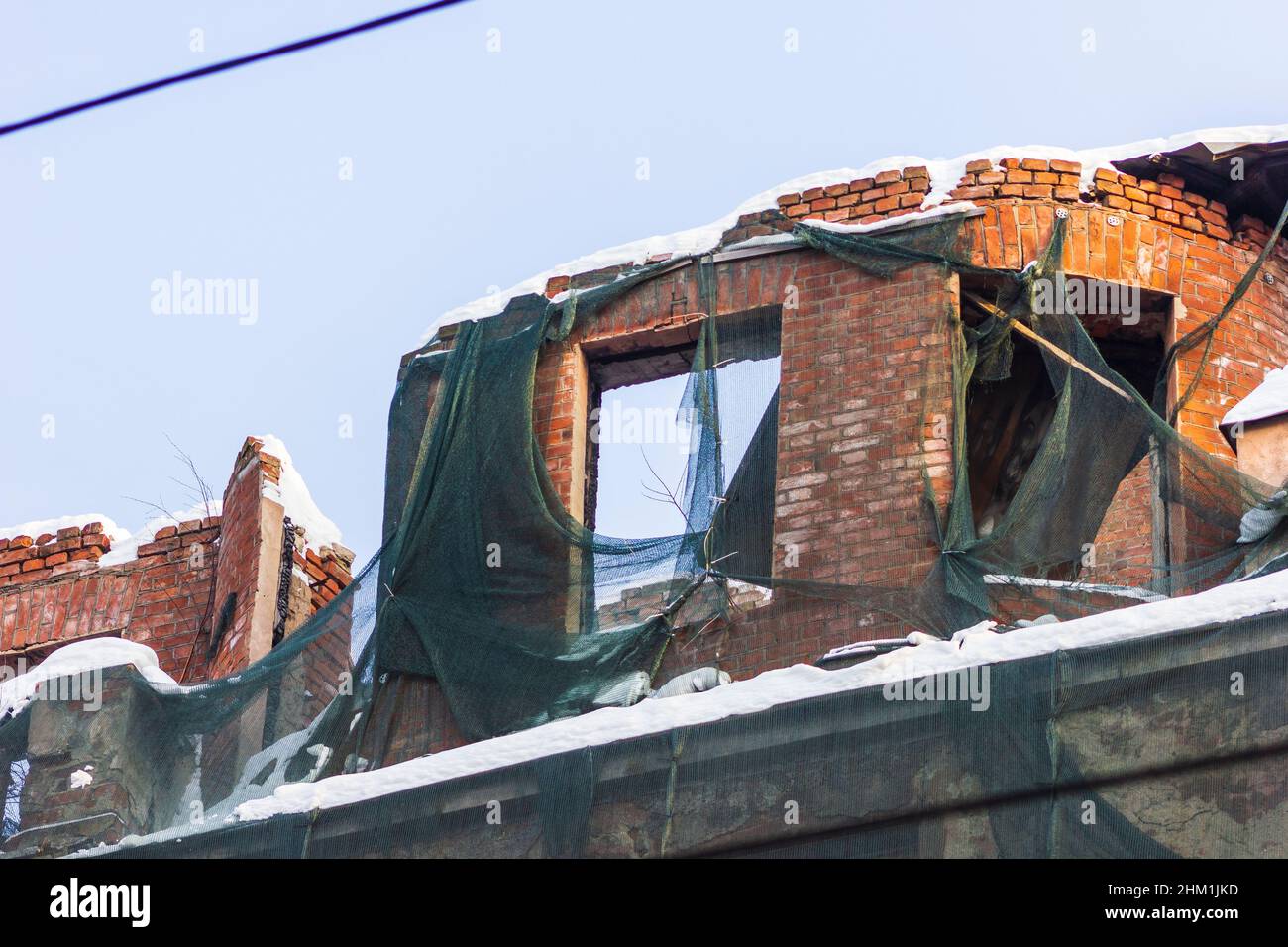 dilapidated housing emergency demolition after fire old city Stock