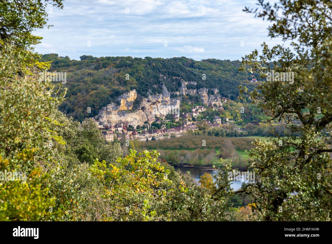 View toward the medieval village of La Roque-Gageac, Perigord, France taken from the garden of the Marqueyssac Castle on a partly overcast autumn afte Stock Photo