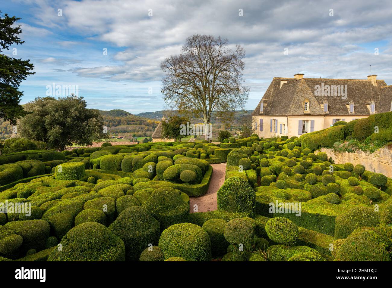 Topiary extravaganza of various shapes of  the Marqueyssac castle in Perigord, France, taken on a partly overcast autumn afternoon Stock Photo
