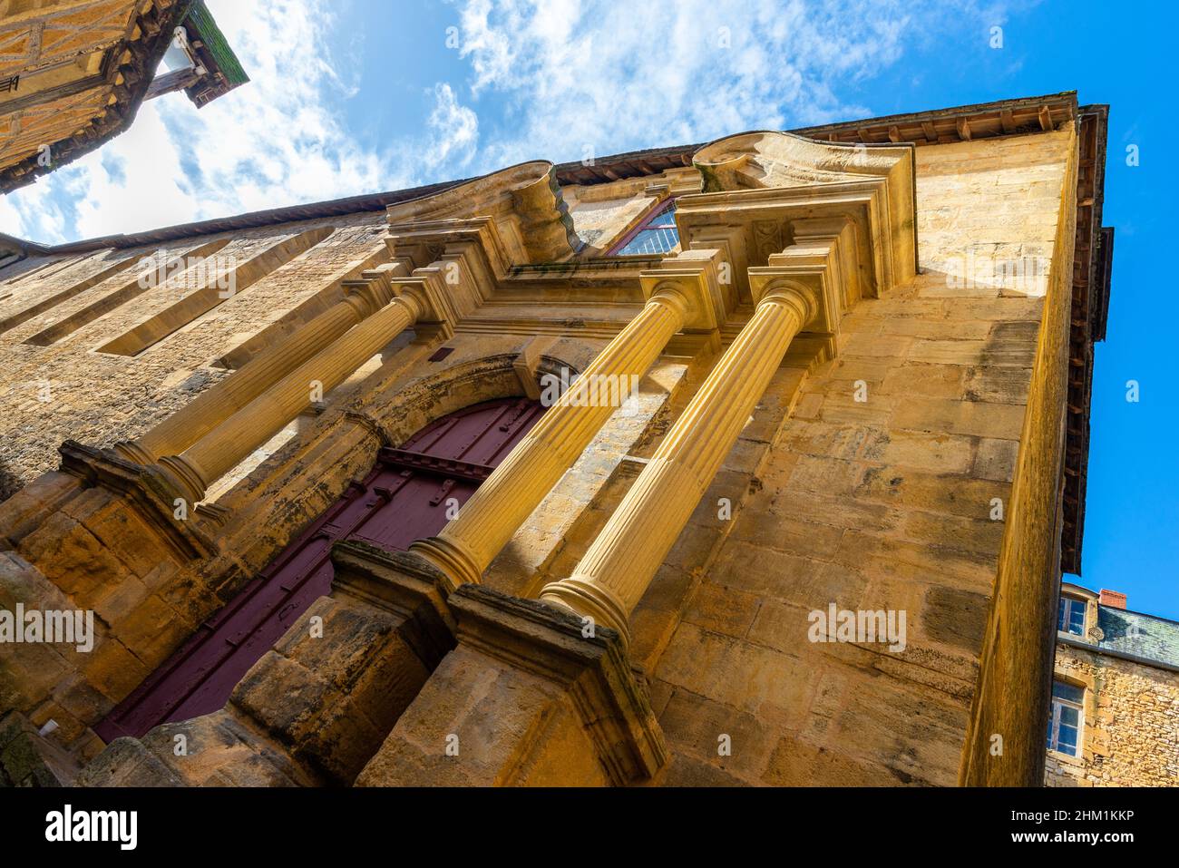 The renaissance facade of a church in a beautiful french yellow stone town of Sarlat-la-Caneda located in Perigord, France, taken on a sunny autumn af Stock Photo