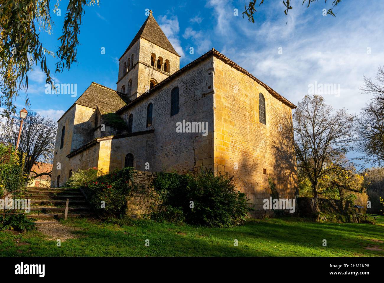 Yellow stone Roman church of Saint-Leon-sur-Vezere in Perigord, France. Taken on a sunny autumn afternoon with no people. Stock Photo