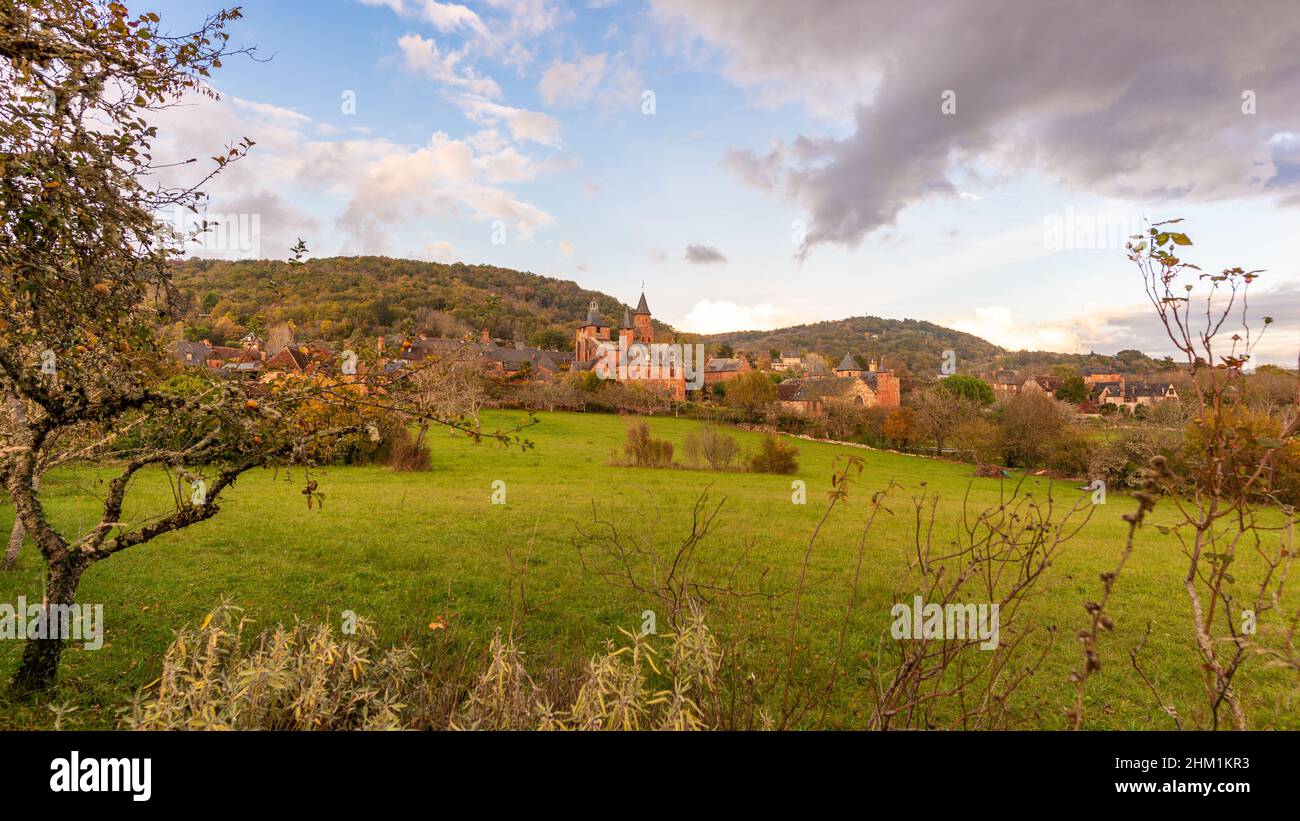 A general view of the traditional town of Collonges-la-Rouge in Correze, France, taken on a partly sunny autumn afternoon with no people. Stock Photo