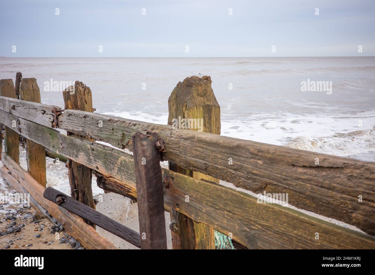 Cromer, Norfolk, UK February 2022. Wooden groynes to protect the