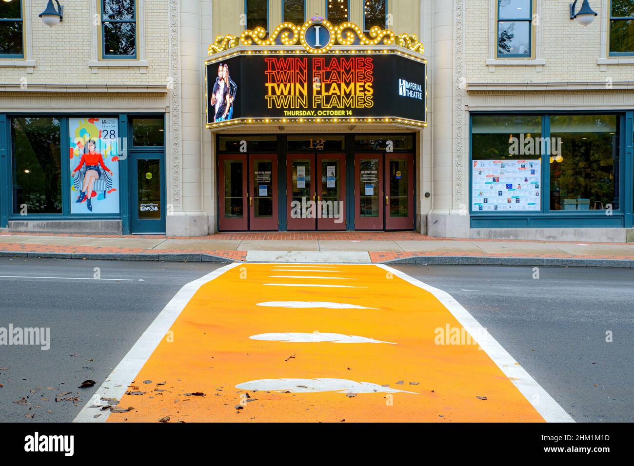 Saint John, NB, Canada - October 14, 2021: An Indigenous themed orange crosswalk stretches in front of the Imperial Theater. Stock Photo