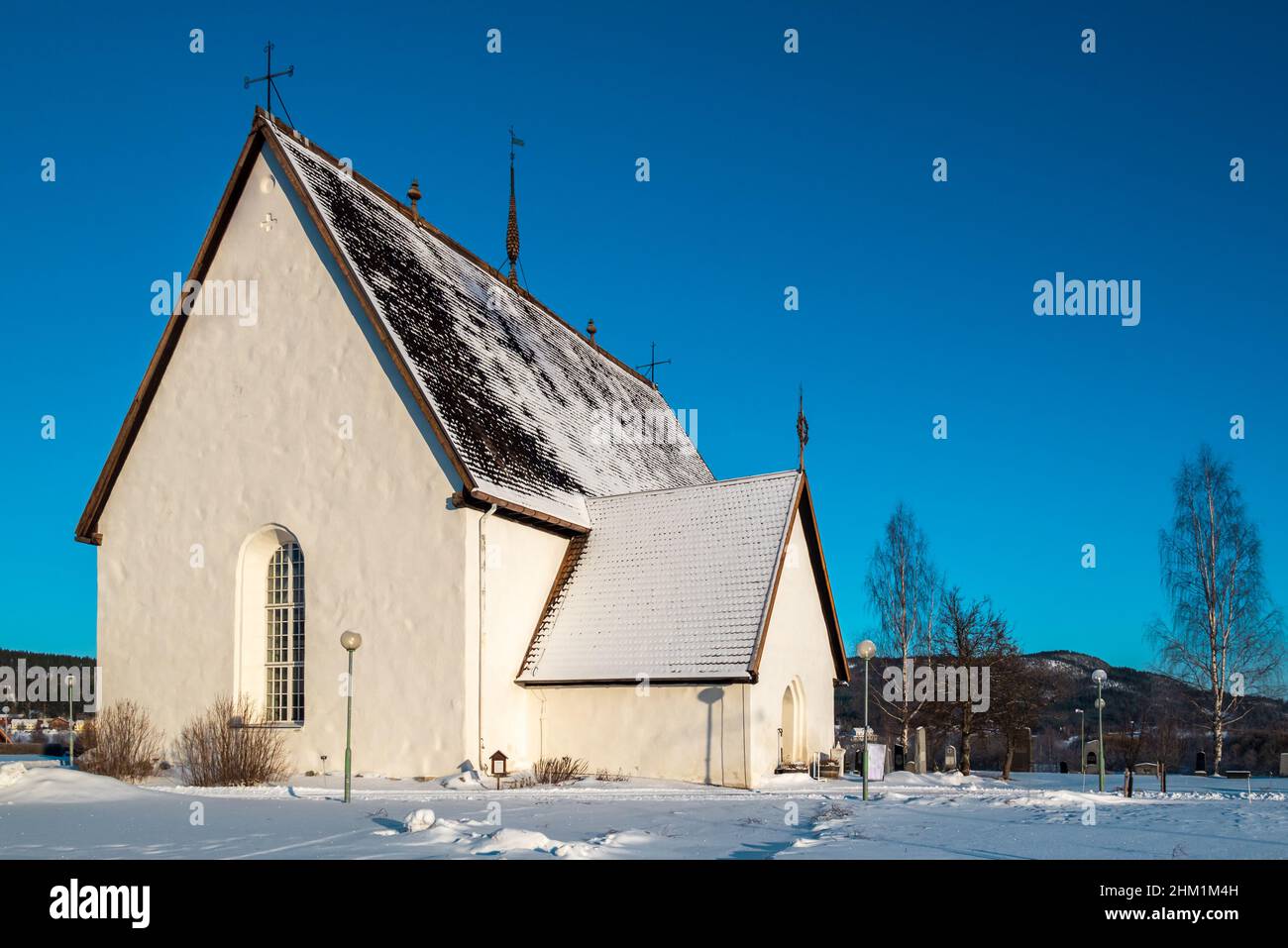 Old little white church with a blue sky in background, picture from Bredbyn village vasternorrland Sweden. Stock Photo