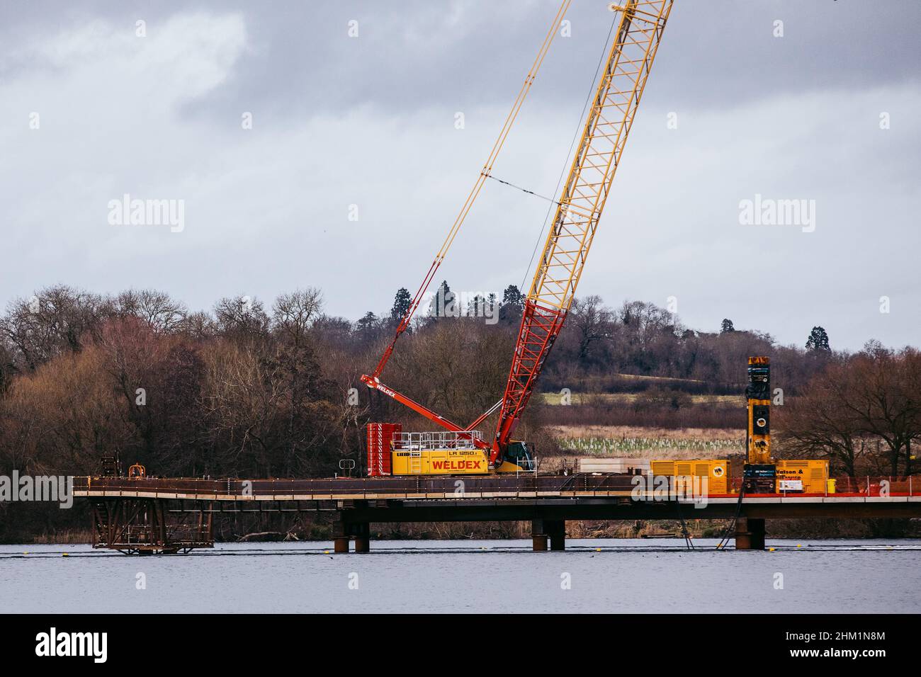 Harefield, UK. 5th February, 2022. Construction works for the HS2 Colne Valley Viaduct, which will become the UK's longest railway bridge, are pictured at HOAC Lake (Harefield Lake No. 2). A viaduct requiring 292 piles driven into the aquifer, a natural water filtration system, is currently being constructed to carry HS2 across lakes and watercourses in the Colne Valley Regional Park. Credit: Mark Kerrison/Alamy Live News Stock Photo