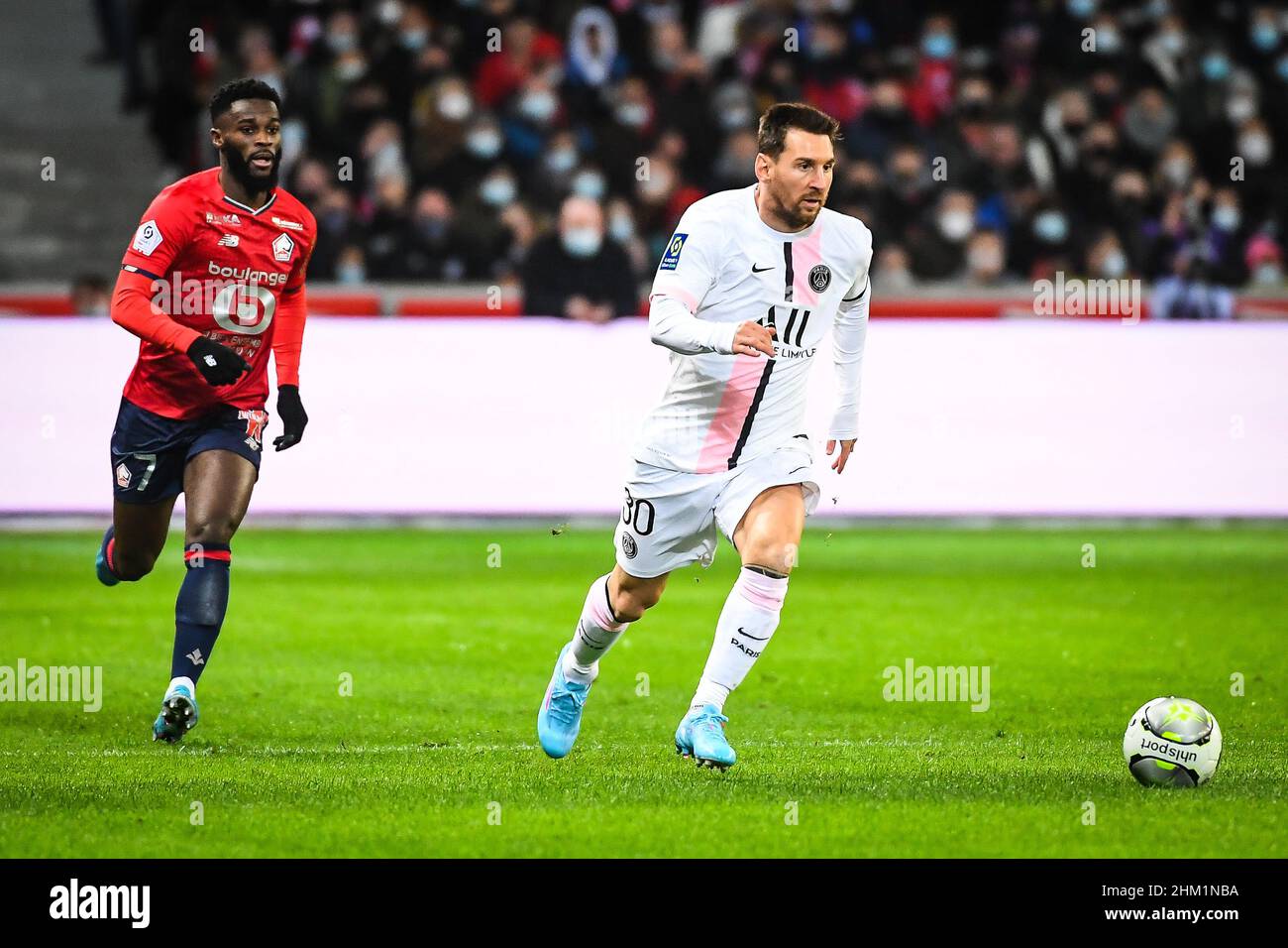 Lille, France. 6th February, 2022. Jonathan BAMBA of Lille and Lionel (Leo)  MESSI of PSG during the French championship Ligue 1 football match between  LOSC Lille and Paris Saint-Germain on February 6,