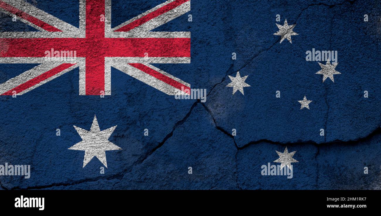 Full frame photo of a weathered flag of Australia painted on a cracked ...