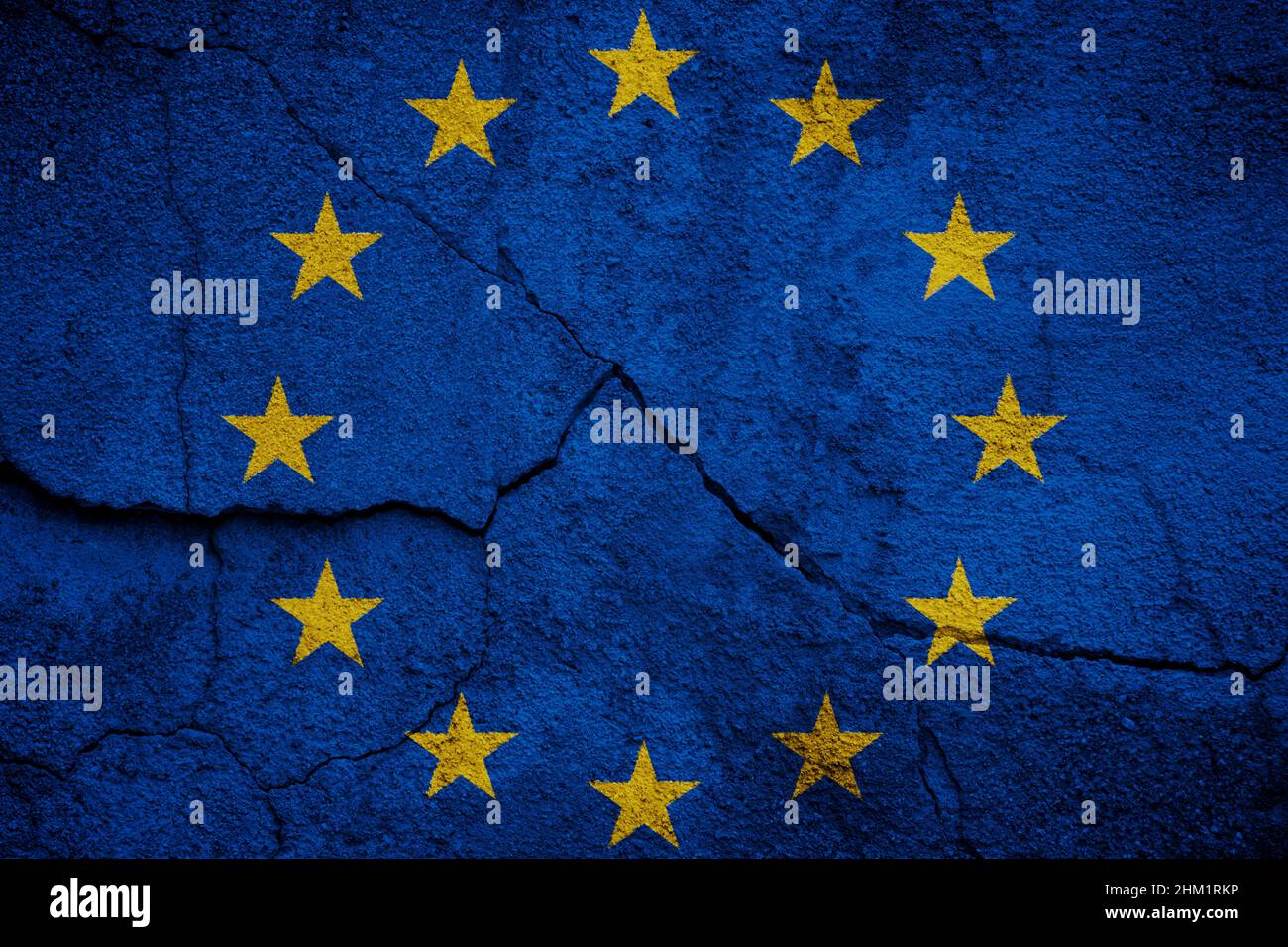 Full frame photo of a flag of Europe (EU, European Union) painted on a cracked wall. Stock Photo