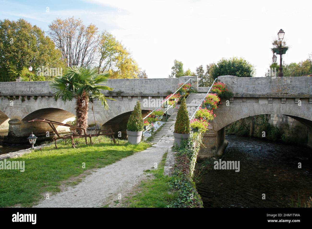 A bridge crossing the river Charente at Verteuil sir Charente, France Stock Photo
