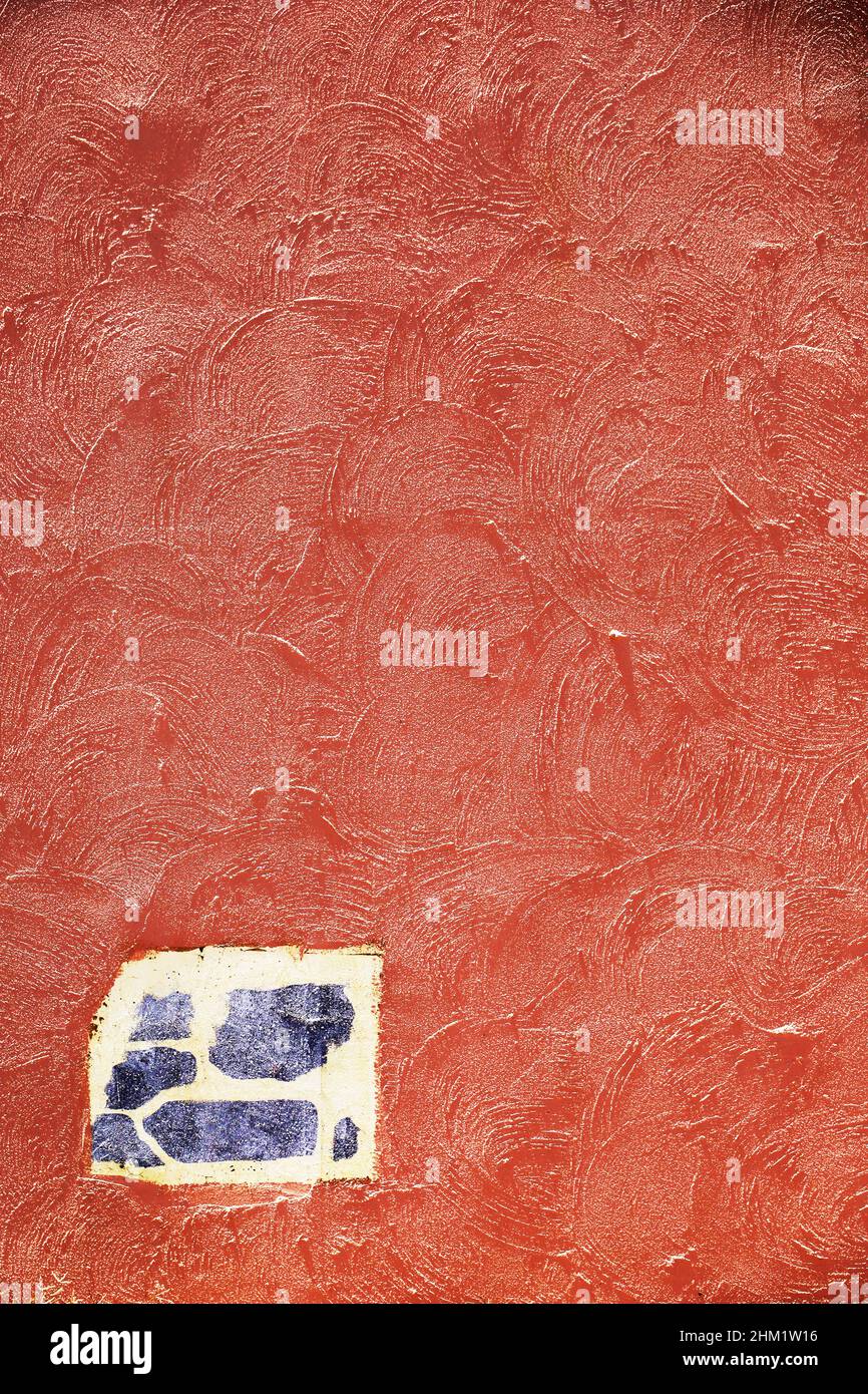 Photograph for background material taken from the front of a terracotta color plaster wall Stock Photo