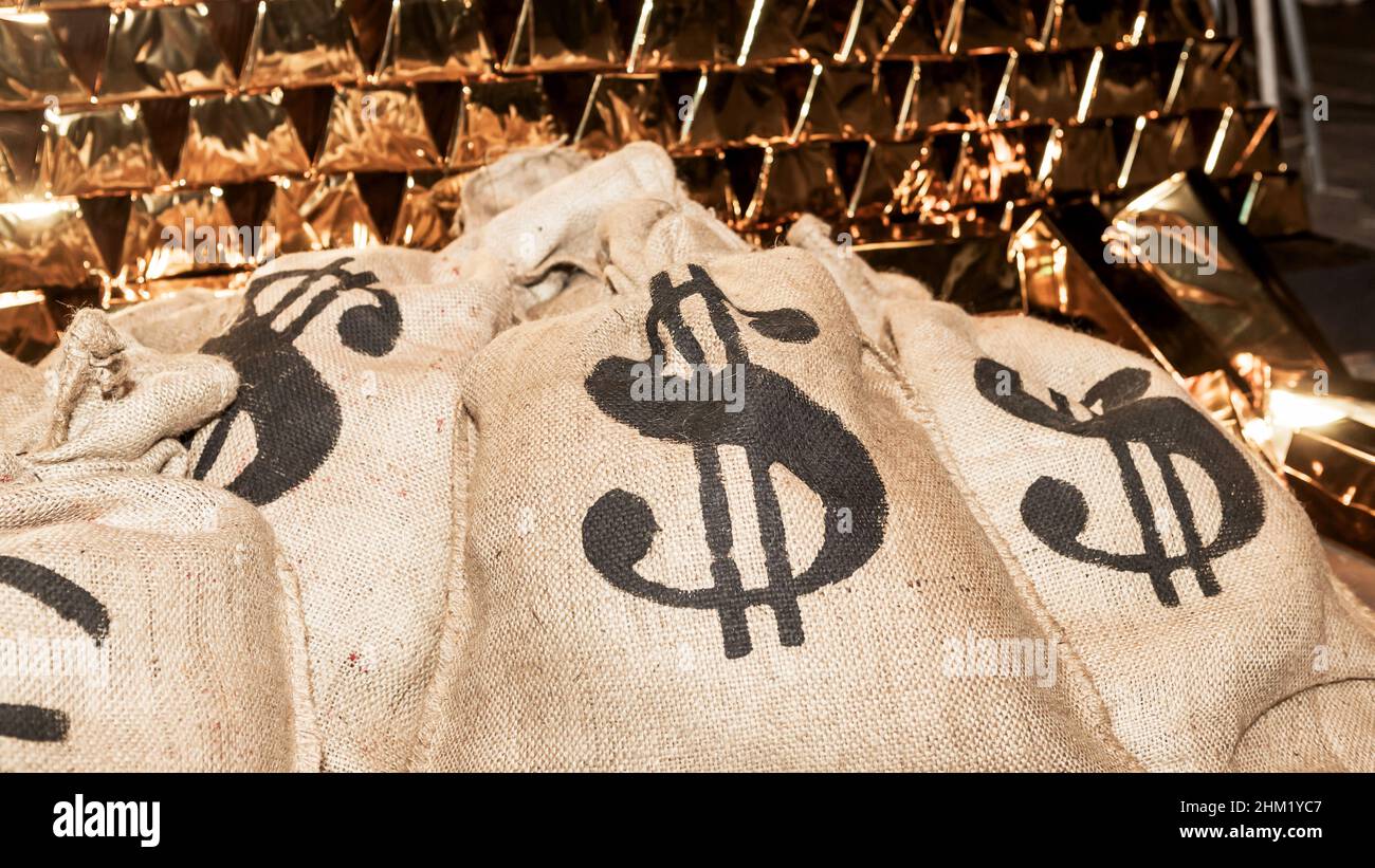 theatrical scenery, money bags with US dollar, Euro and gold bullion Stock Photo