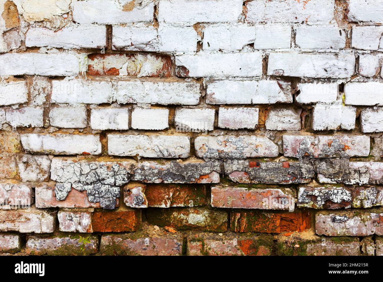 Abstract background old white brick wall with cracks and scratches ...