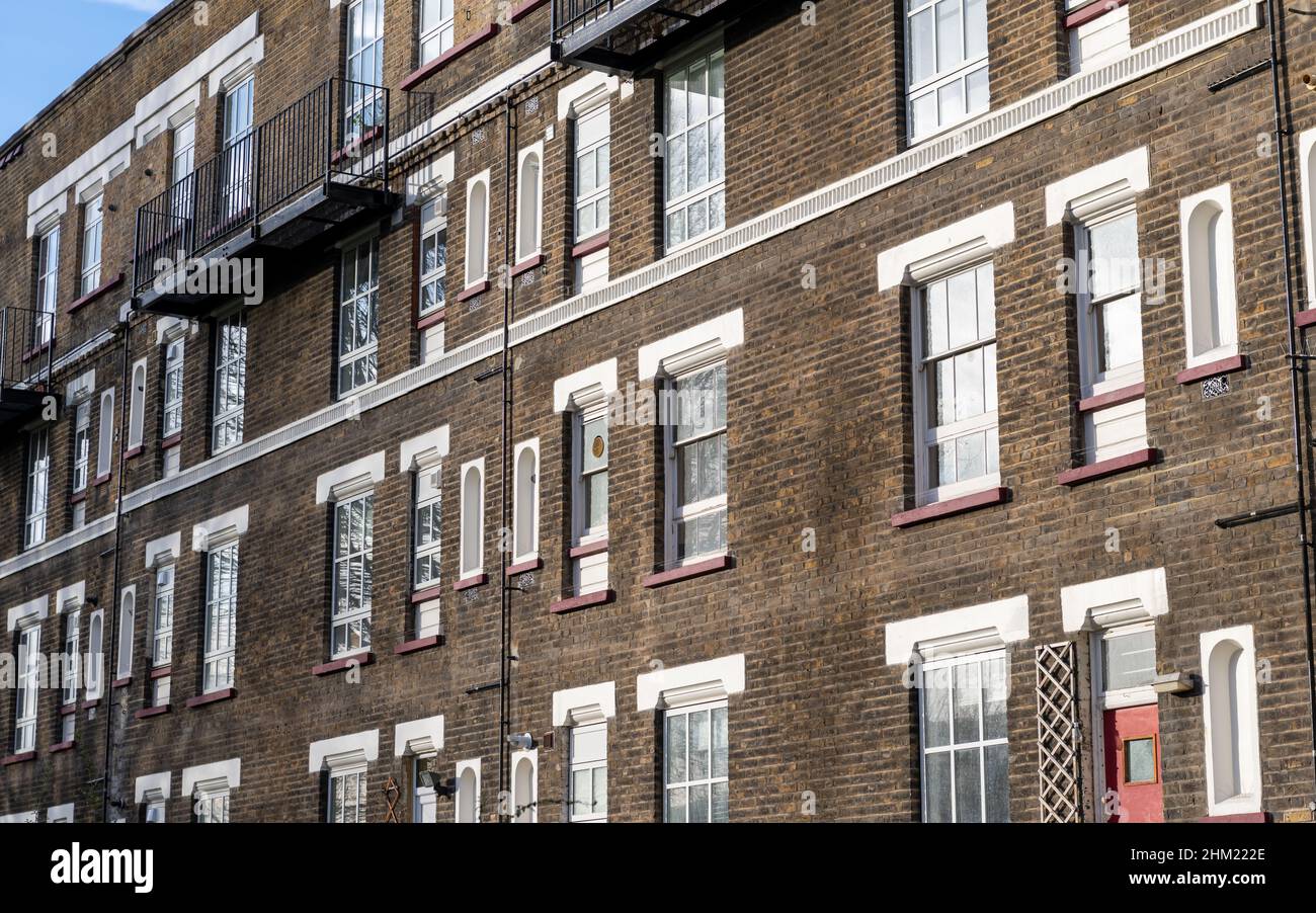 A dated terraced block of flats in the East End of London. UK. Originally built to house working class families. Stock Photo