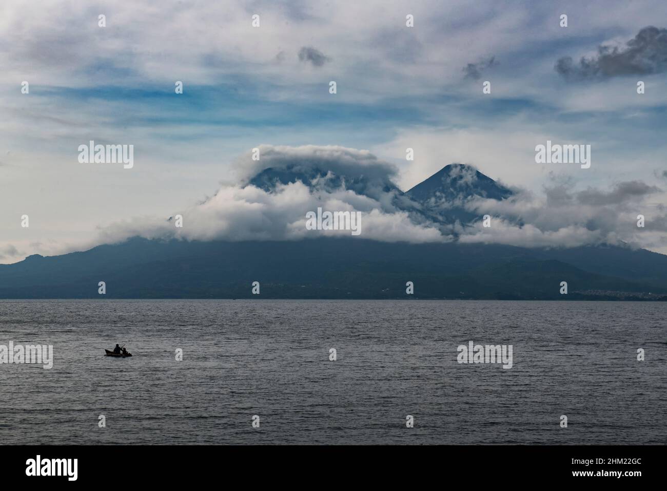 View of Volcán San Pedro, Volcán Tolimán, and Volcán Atitlán on Lake Atitlán from San Marcos La Laguna Stock Photo