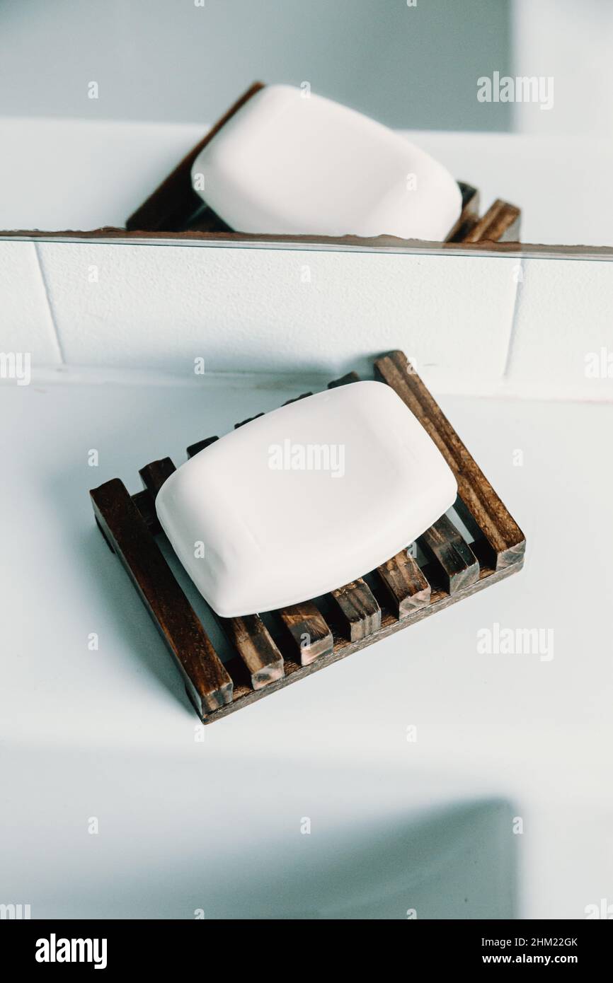 A hard soap over a soap dish in a white toilet Stock Photo Alamy