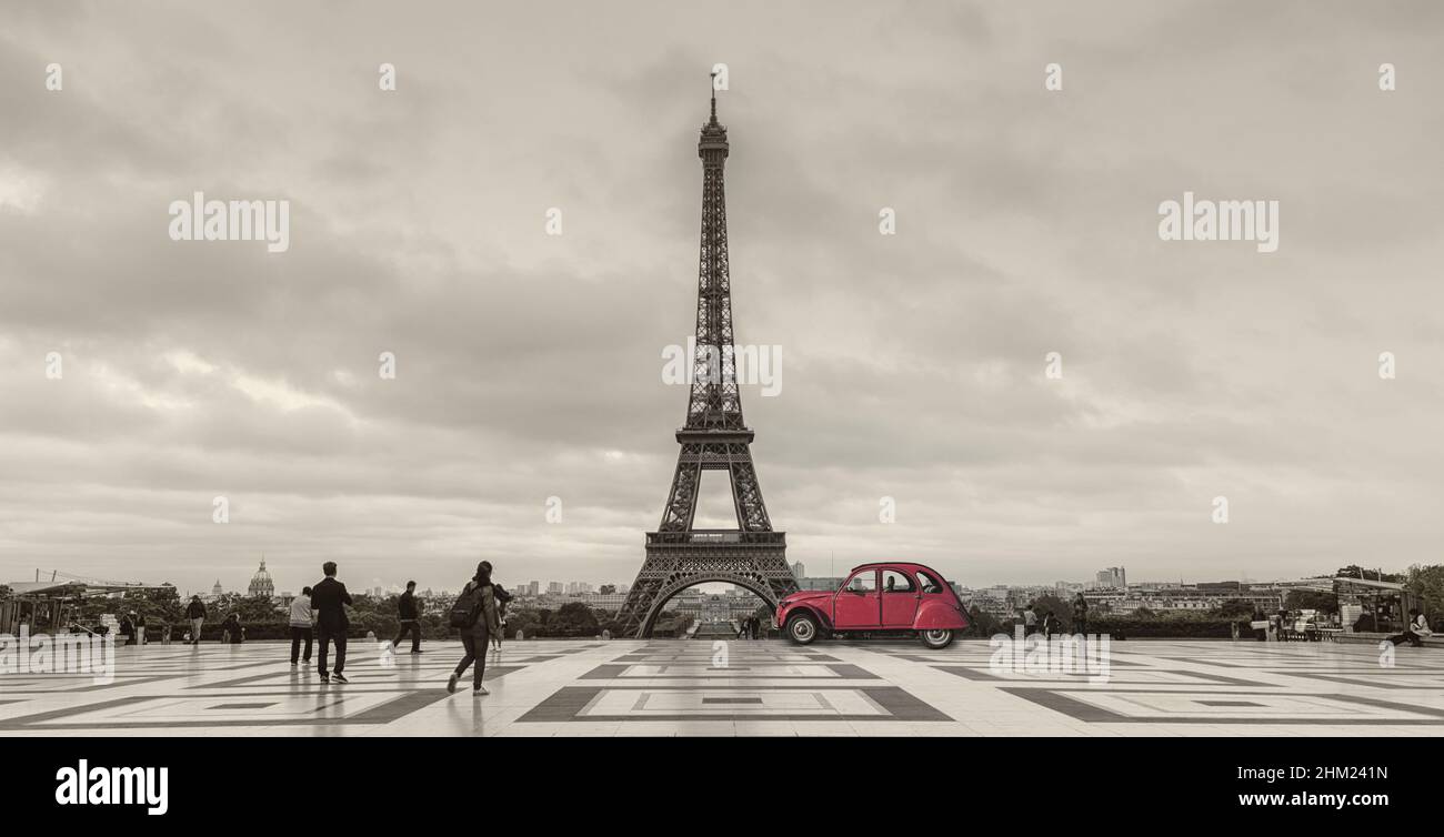 View over Trocadero square to the Eiffell Tower with red retro car, in black and white color-key. Paris, France Stock Photo