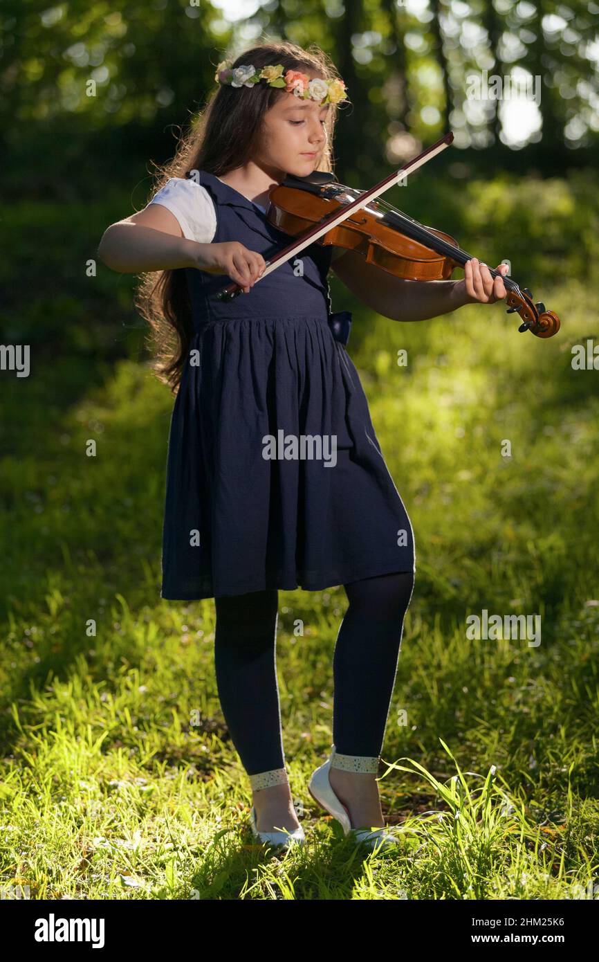 Young girl playing viola Stock Photo Alamy