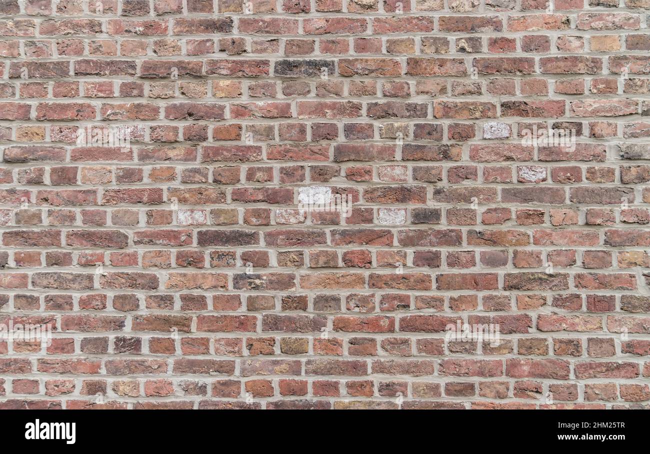 old weathered brick wall Background texture Stock Photo