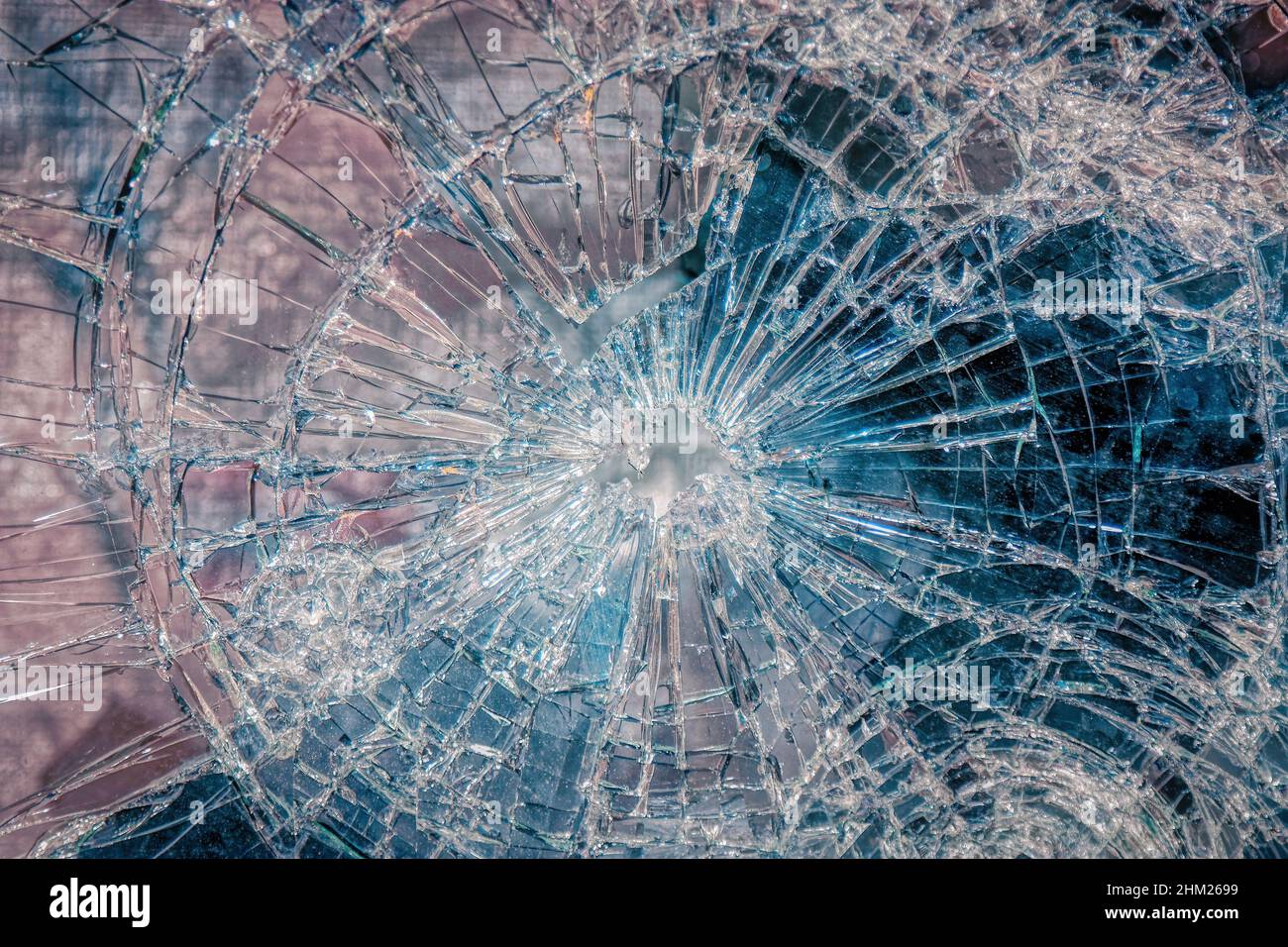 Broken or shattered cracked glass window as a background Stock Photo
