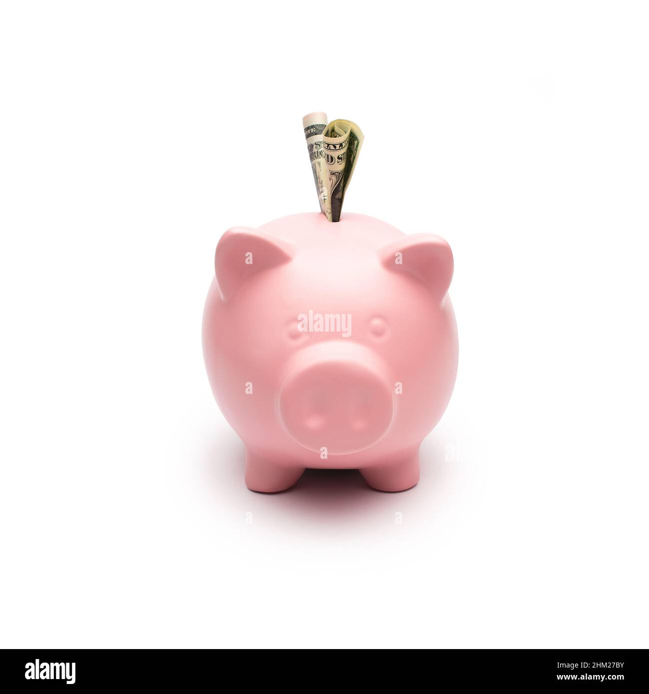 Piggy bank with dollar note Stock Photo
