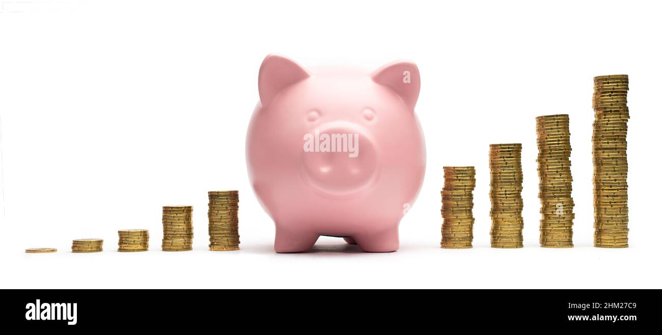 Piggy Bank with stacked coins. Isolated on white background Stock Photo ...