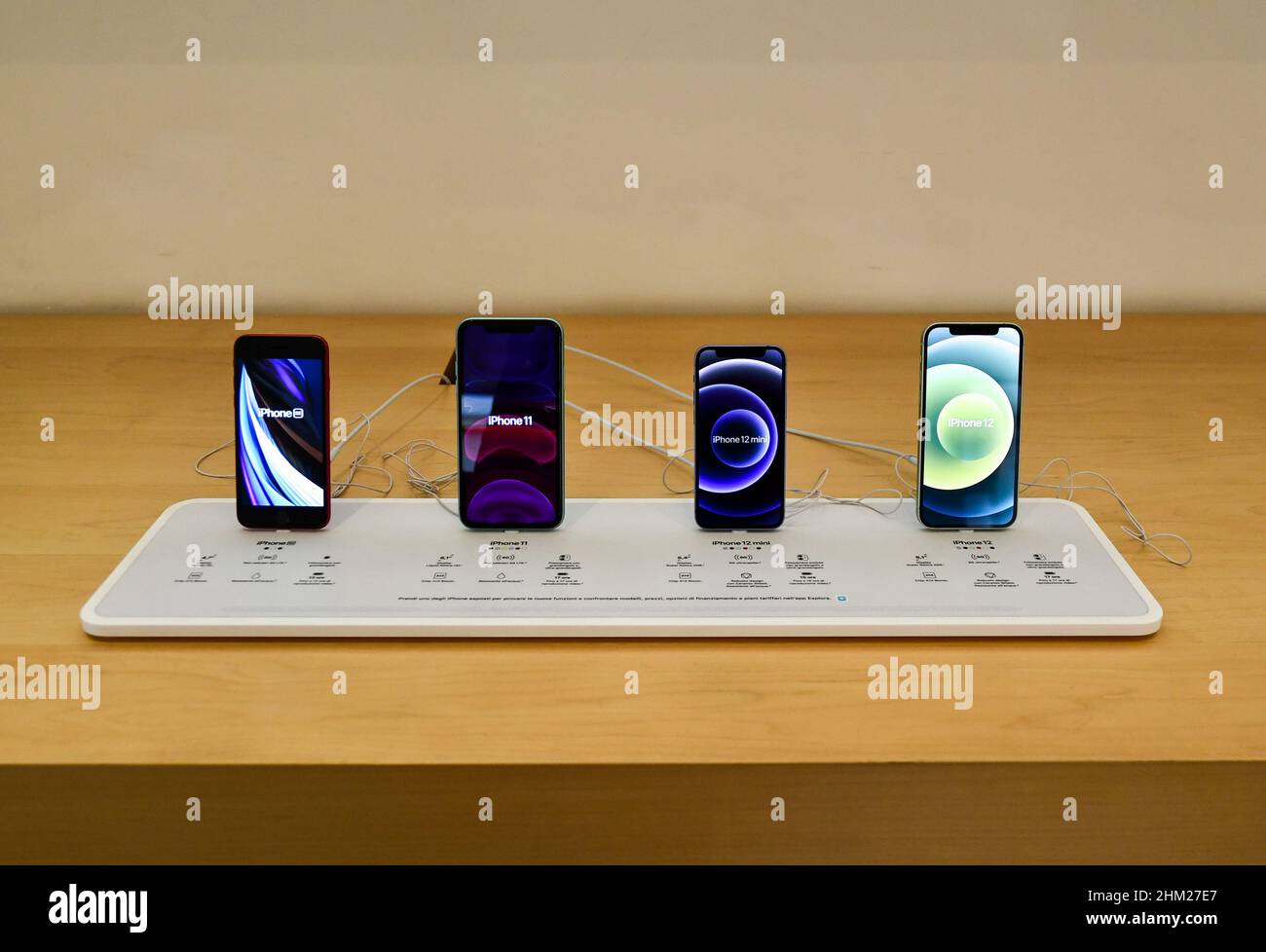 Different models of iPhone displayed inside the Apple Store in Via Roma, Turin, Piedmont, Italy Stock Photo