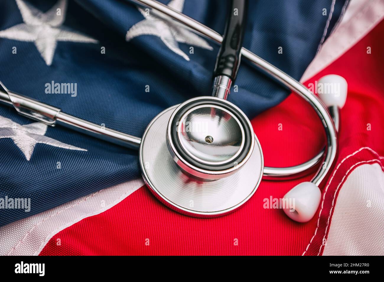 Close-up Photo Of Stethoscope On American Flag Stock Photo