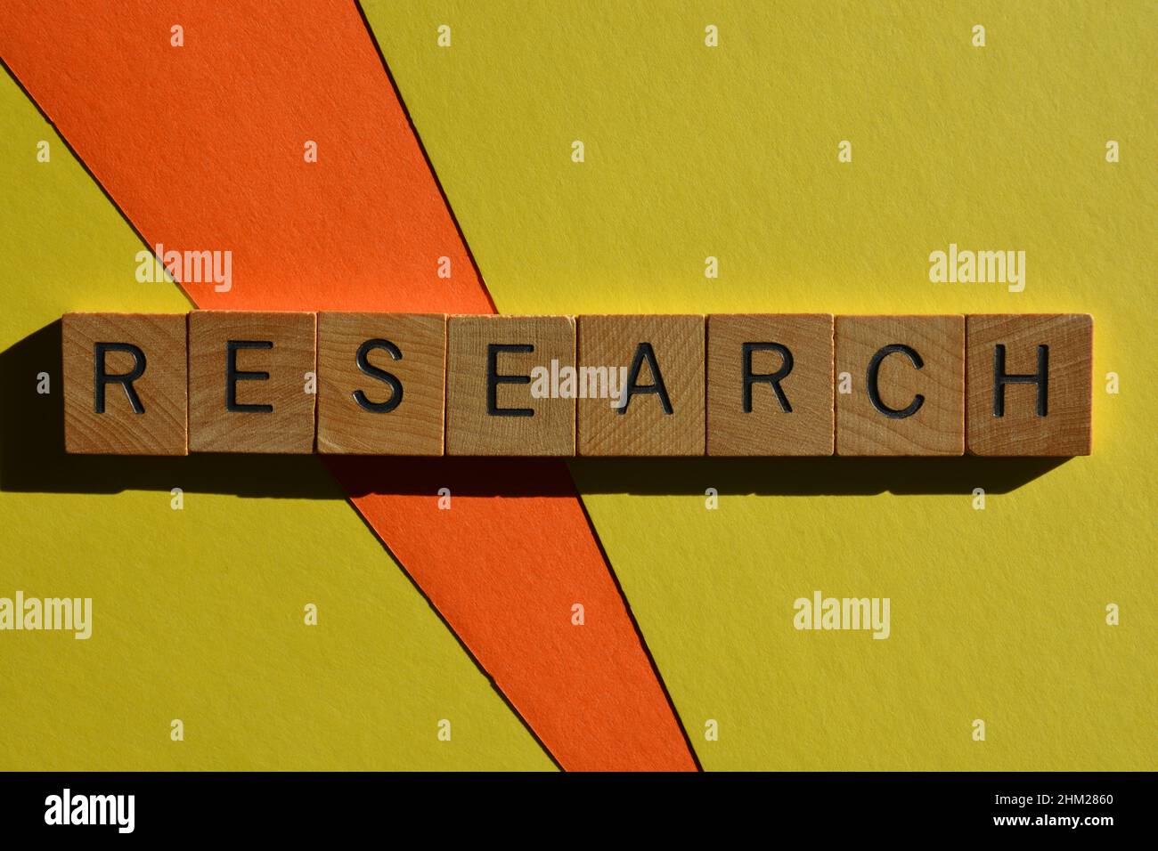 Research, word in wooden alphabet letters isolated on colourful background Stock Photo